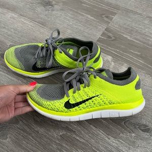 Gray and lime green Nike running womens sneakers